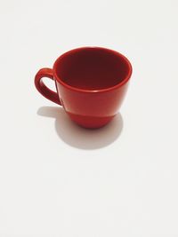 Close-up of red tea over white background