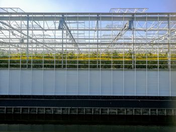 Built structure in greenhouse against sky