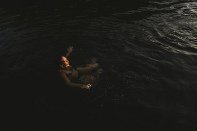 High angle view of woman swimming