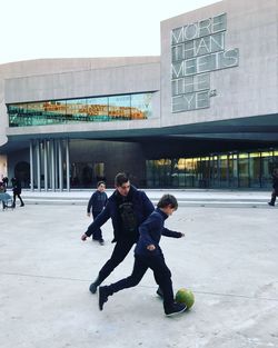 People playing with ball in winter