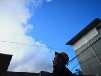 Low angle view of man against sky