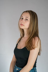 Portrait of a beautiful young woman over white background