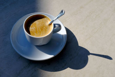High angle view of coffee cup on table