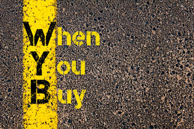 Full frame shot of yellow sign on road