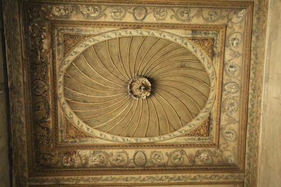 Directly below shot of ornate ceiling