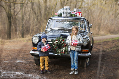 High angle view of couple holding car
