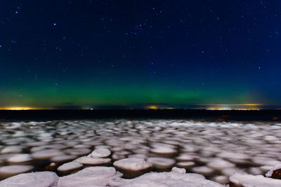 Scenic view of sea against sky at night