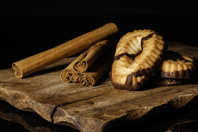Close-up of food on table against black background