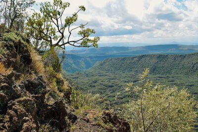 Scenic volcanic crater against a mountain background, suswa conservancy, rift valley, kenya