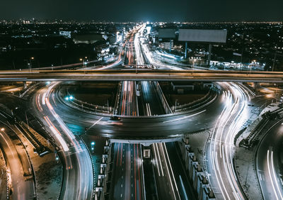 High angle view of light trails on road at night