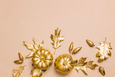 Directly above shot of christmas decorations against pink background