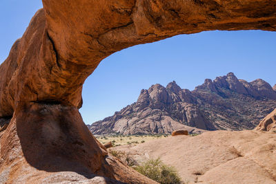 Scenic view of rocky mountains against clear sky