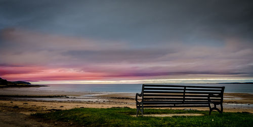 Scenic view of beach against sky during sunset