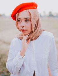 Portrait of young woman looking away