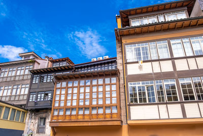 Low angle view of building against blue sky