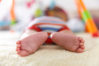 Close-up of baby sleeping on bed at home