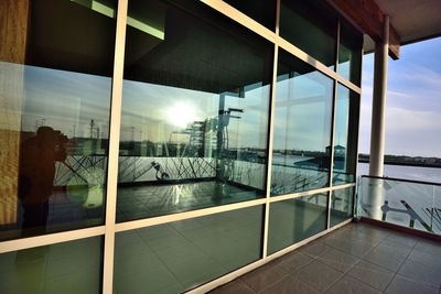 Reflection of building on glass window