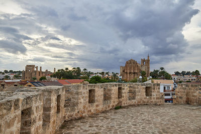 Buildings in city against sky