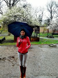 Portrait of young woman in rain