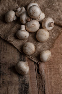 High angle view of mushrooms on the wooden table