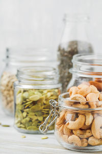 Close-up of nuts in jar on table