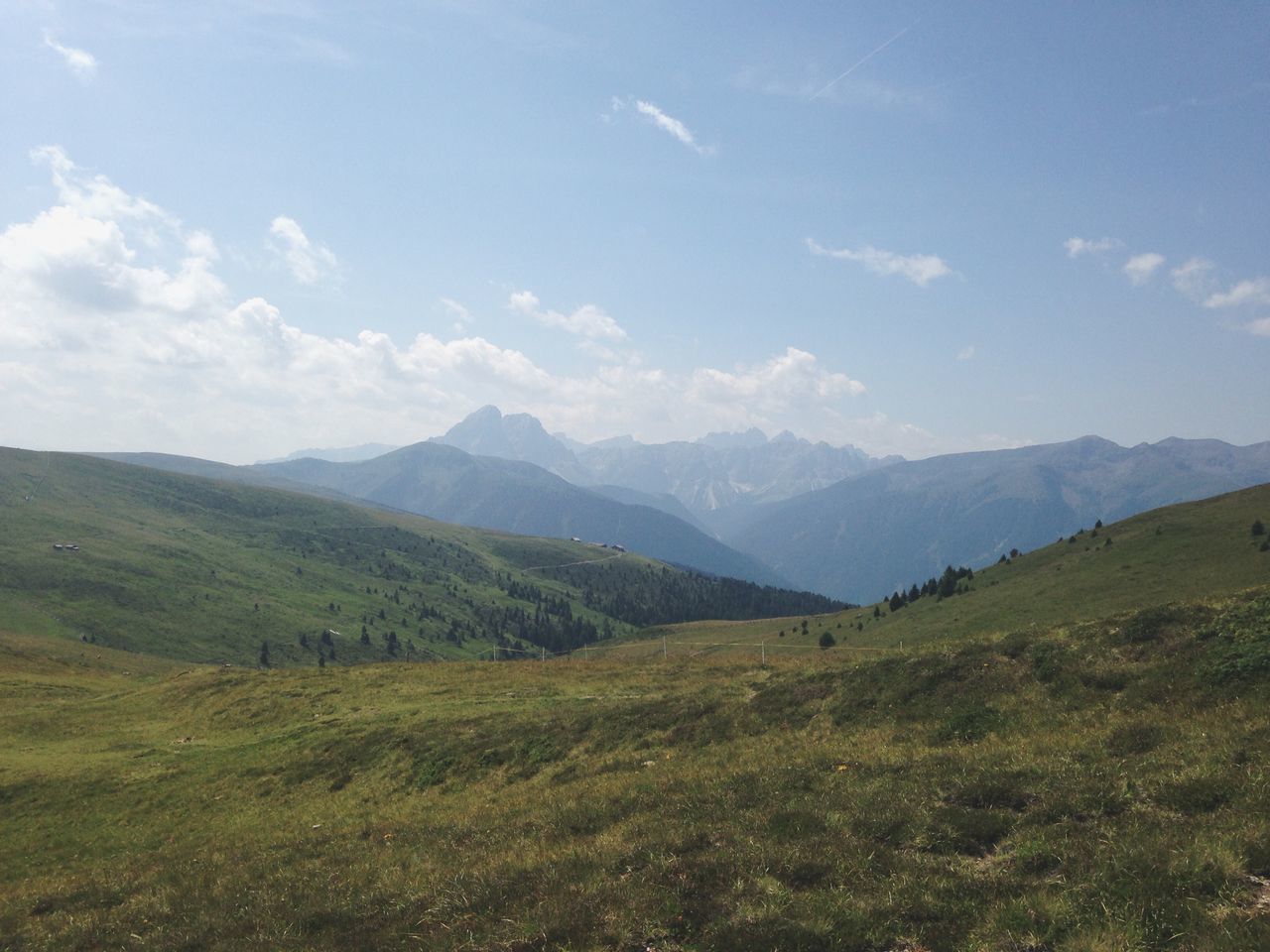 mountain, landscape, tranquil scene, tranquility, scenics, sky, grass, beauty in nature, mountain range, nature, non-urban scene, field, green color, idyllic, cloud - sky, grassy, remote, cloud, hill, day