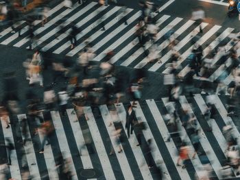 Blurred motion of people on street