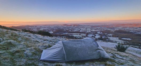Scenic view of mountains against sky during sunset