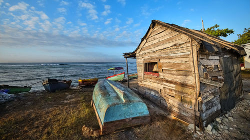 Building by sea against sky