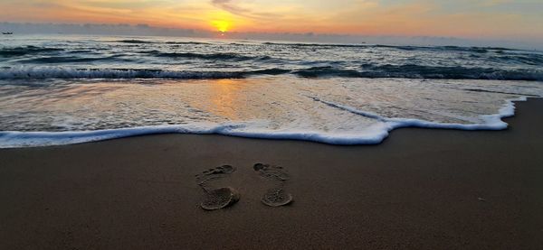 Scenic view of sea against sky during sunset