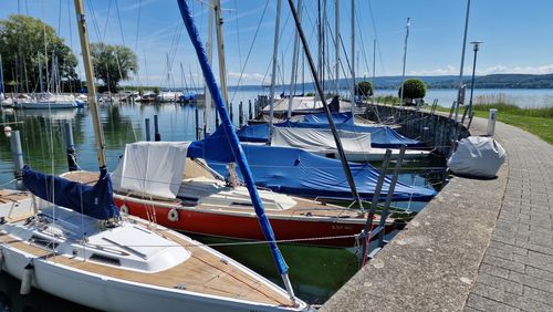 Boats moored at harbor