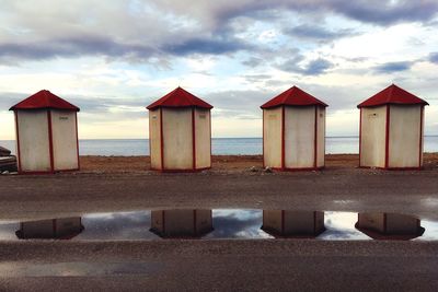 Built structure on beach against sky