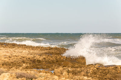 Scenic view of sea against clear sky