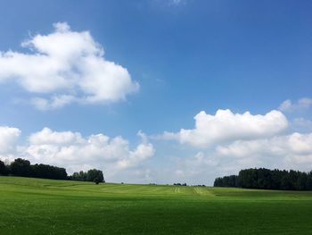 Scenic view of landscape against cloudy sky