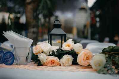 Close-up of white roses on table