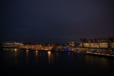 Illuminated buildings in city at night