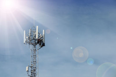 Low angle view of communications tower against sky