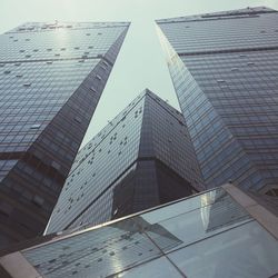 Low angle view of modern office building against sky