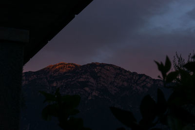 Scenic view of mountains against sky at night