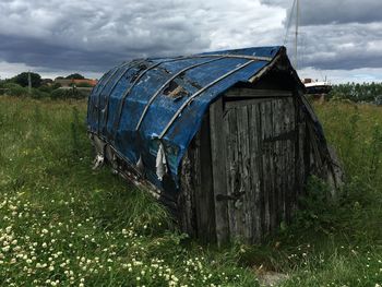 Abandoned log cabin on meadows