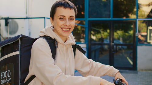 Portrait of young woman standing in gym