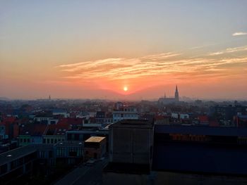 High angle view of city at sunset