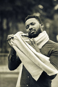 Portrait of young man standing outdoors