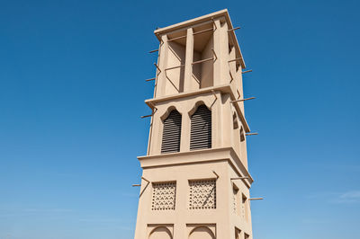 Low angle view of temple against clear blue sky