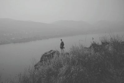 Rear view of a man in lake