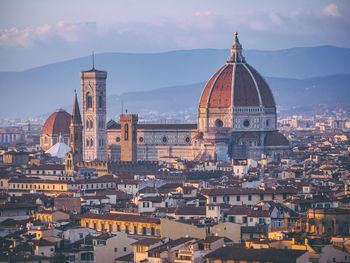 High angle view of buildings in city against sky