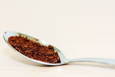 Close-up of coffee on table against white background