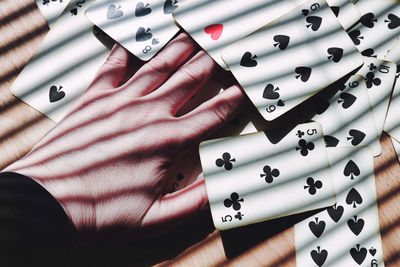 High angle view of woman playing cards