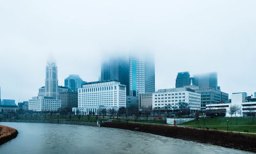 Modern buildings in city against sky