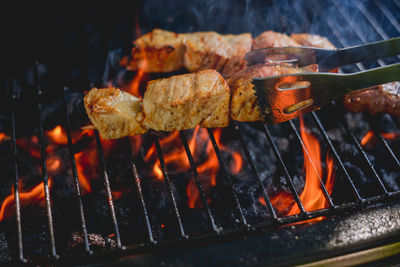 Close-up of meat on barbecue grill